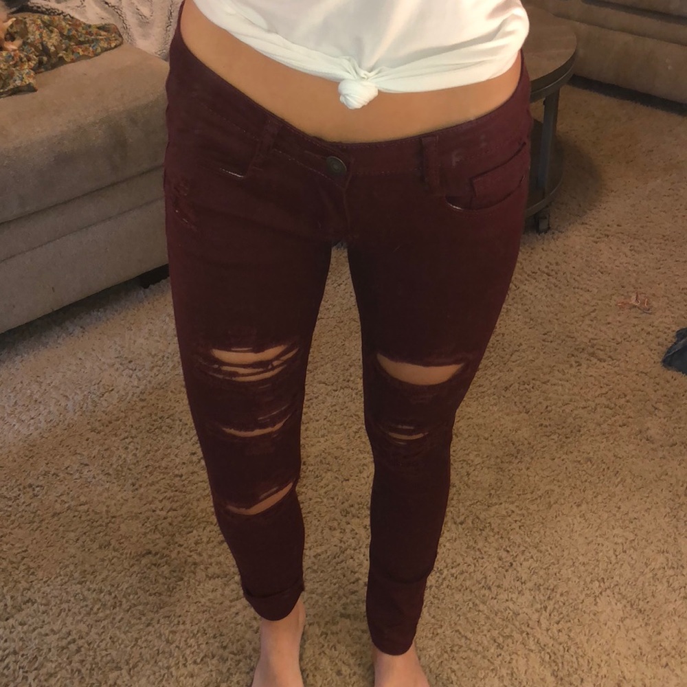 Maroon ripped jeans